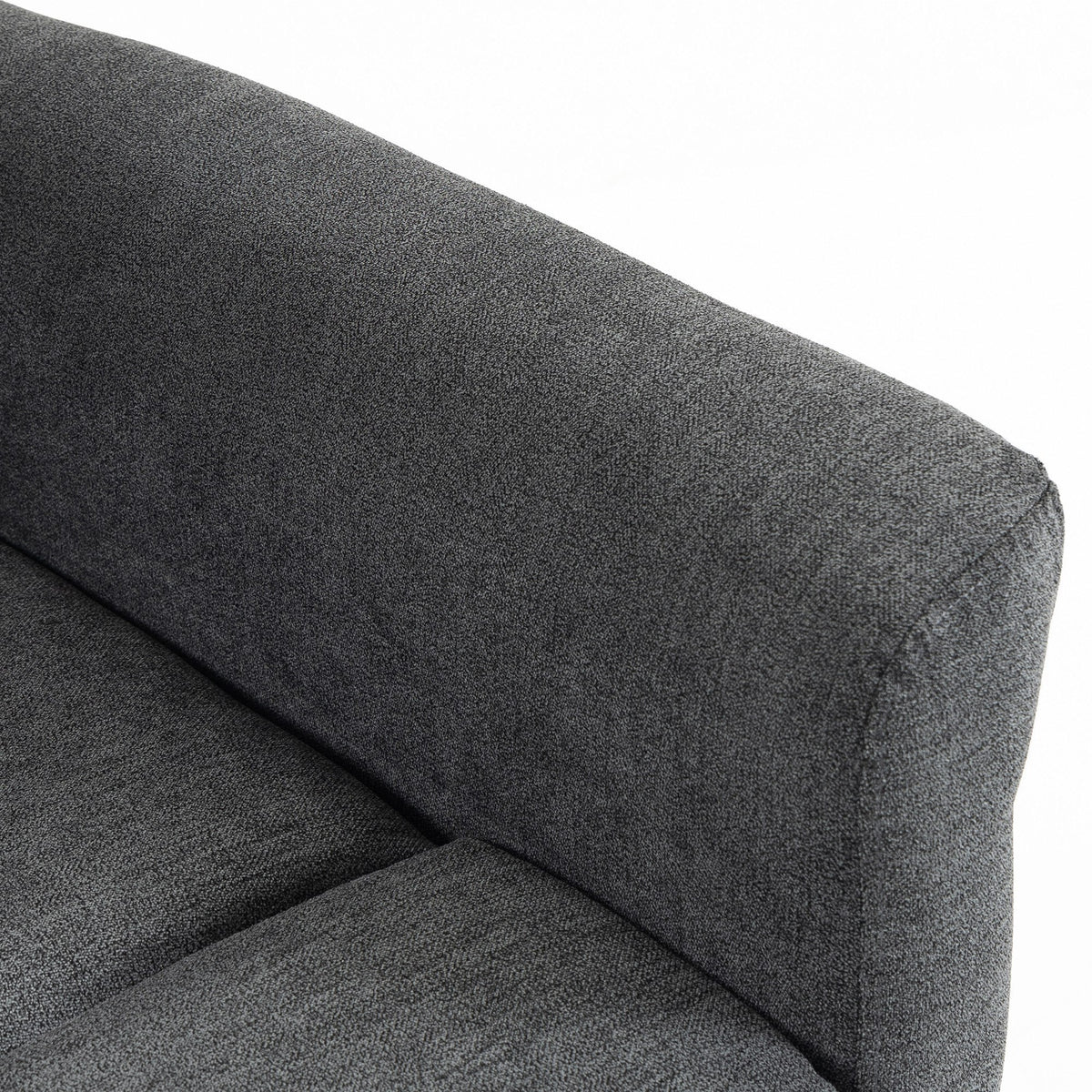 Close-up of dark grey chenille recliner cushion with smooth padded seams
