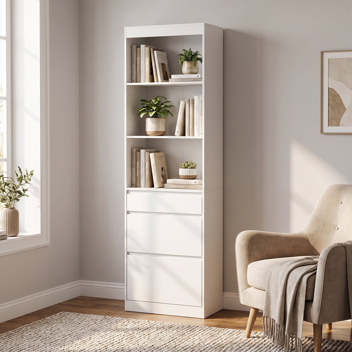 White bookcase with open shelves and three drawer fronts, standing upright in a room.