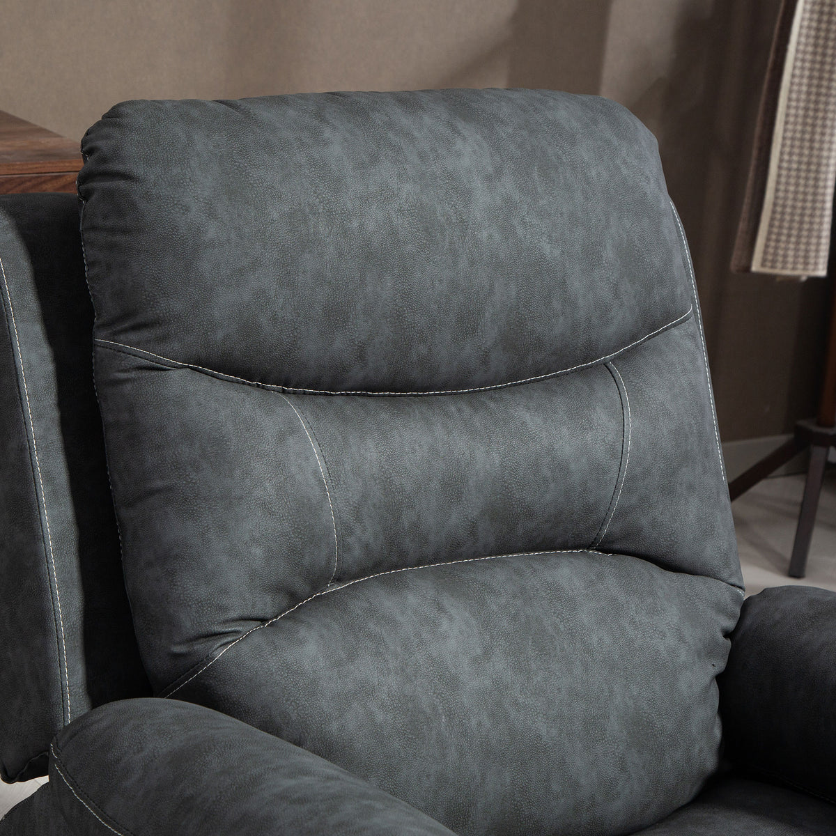 Grey recliner backrest cushion with contrast stitching and smooth upholstery