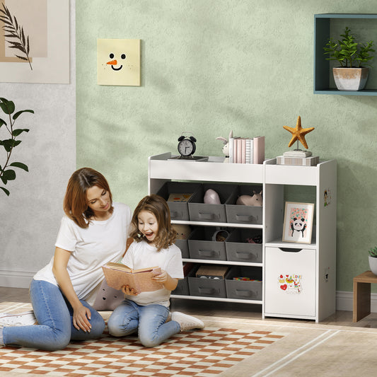 White kids toy storage organizer cabinet with open shelves and gray bins, two children reading