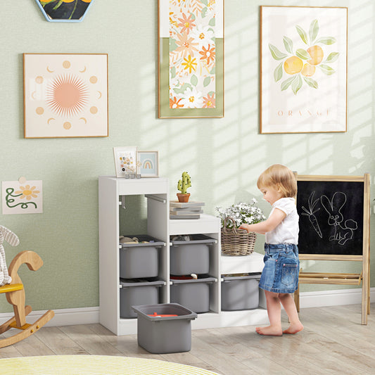 Three-layer toy storage organizer with removable grey bins, open front cubbies