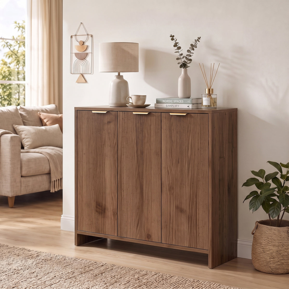 Brown sideboard cabinet with three doors and slim gold bar handles