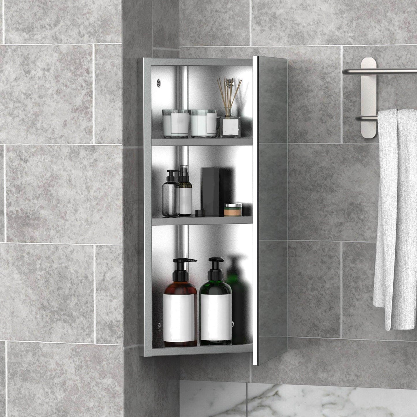 Modern bathroom storage cabinet with single mirrored door, shelves holding toiletries, mounted on gray tiled wall