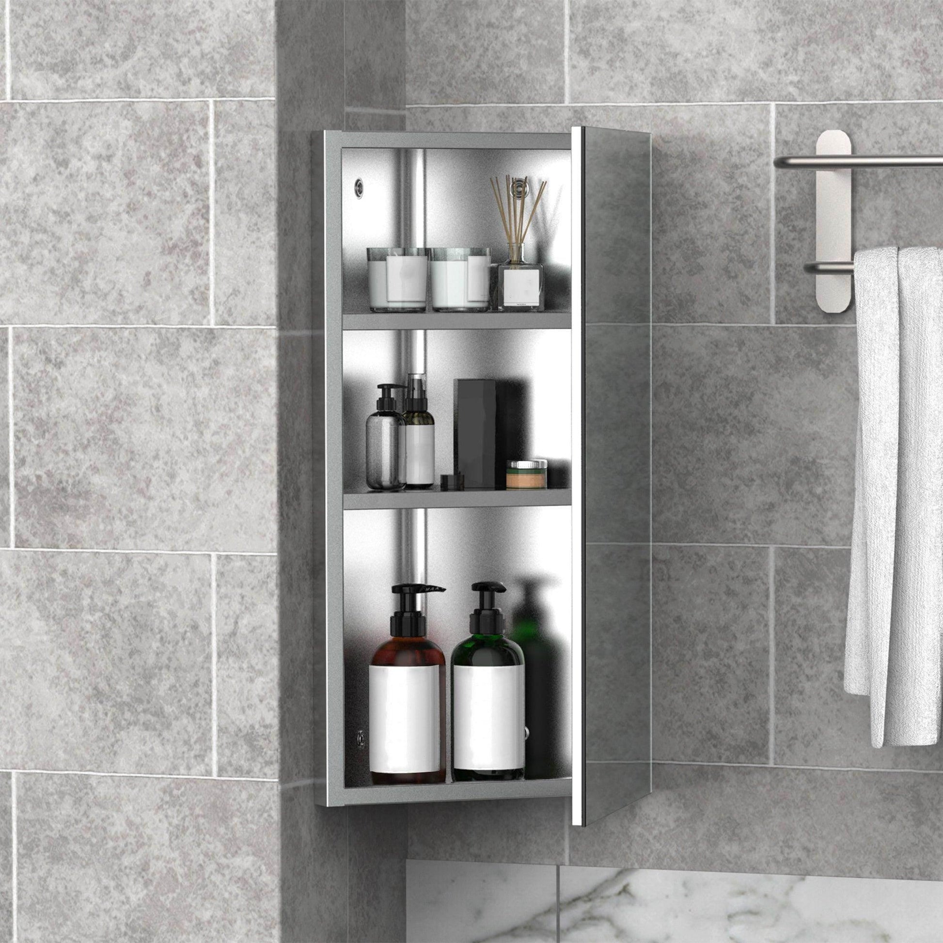 Modern bathroom storage cabinet with single mirrored door, shelves holding toiletries, mounted on gray tiled wall