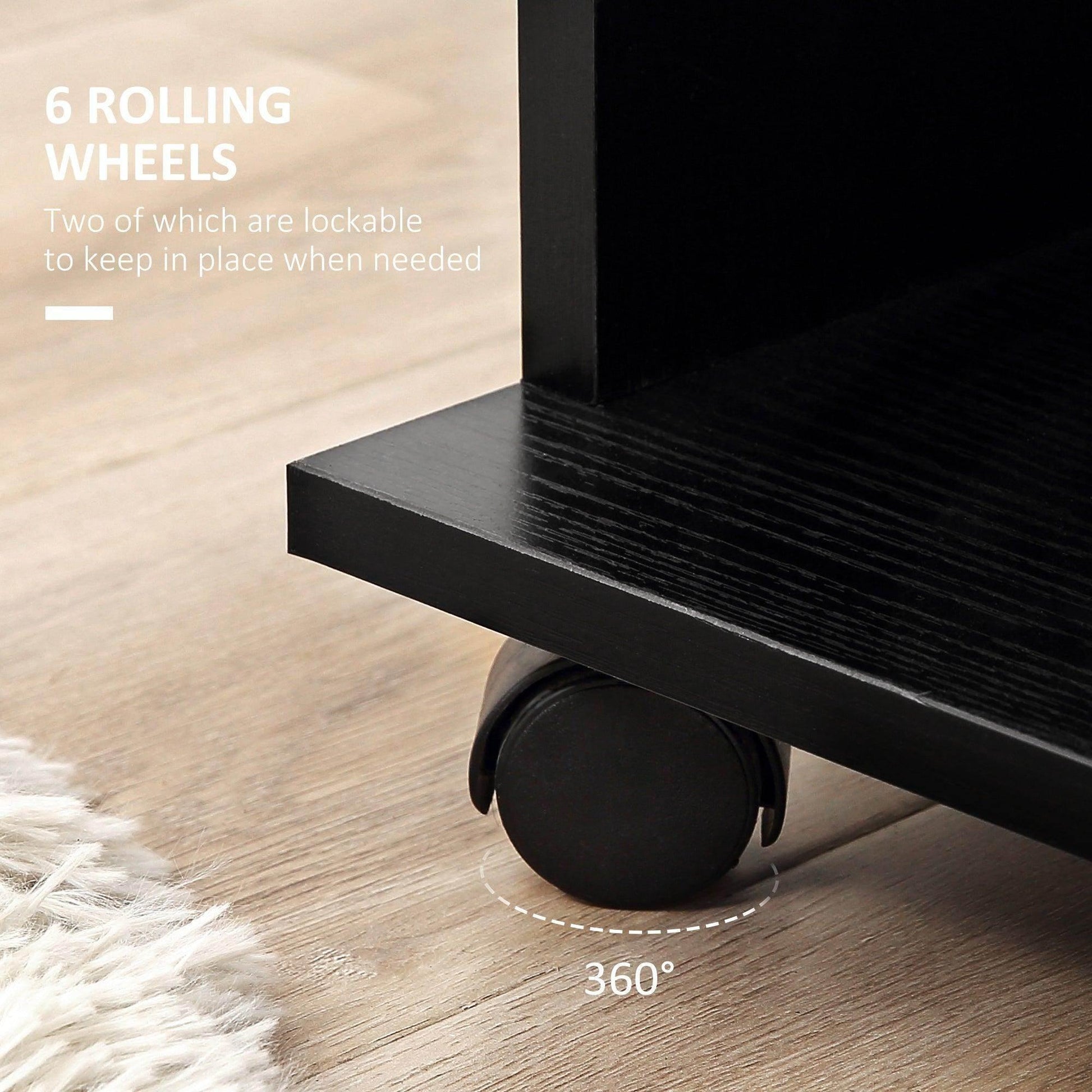 Close-up of black wardrobe bottom corner with lockable rolling wheel on wooden floor