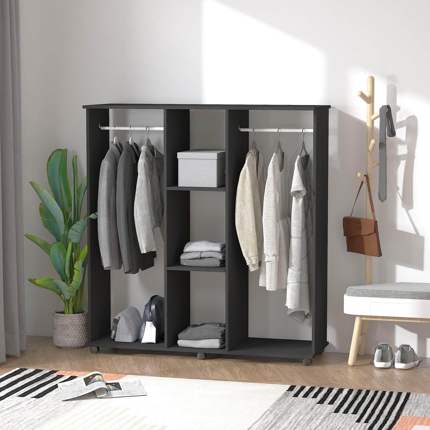 Black double open wardrobe with hanging rails holding jackets and shirts, shelves with folded clothes, in a modern room with plant, coat rack, bench, and striped rug