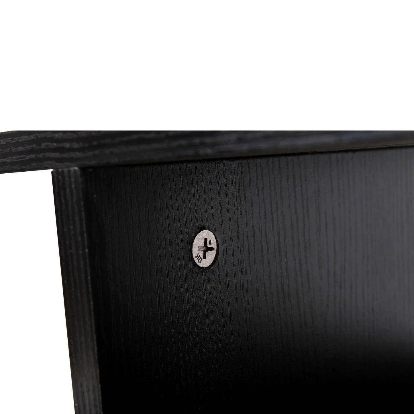 Close-up of black wooden TV stand corner with visible screw hardware and wood grain texture