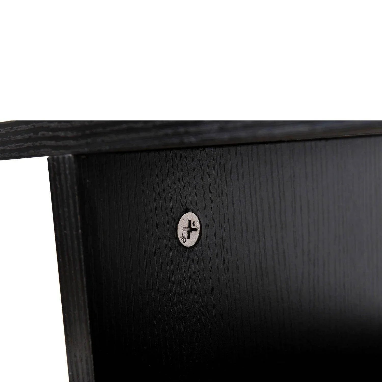 Close-up of black wooden TV stand corner with visible screw hardware and wood grain texture