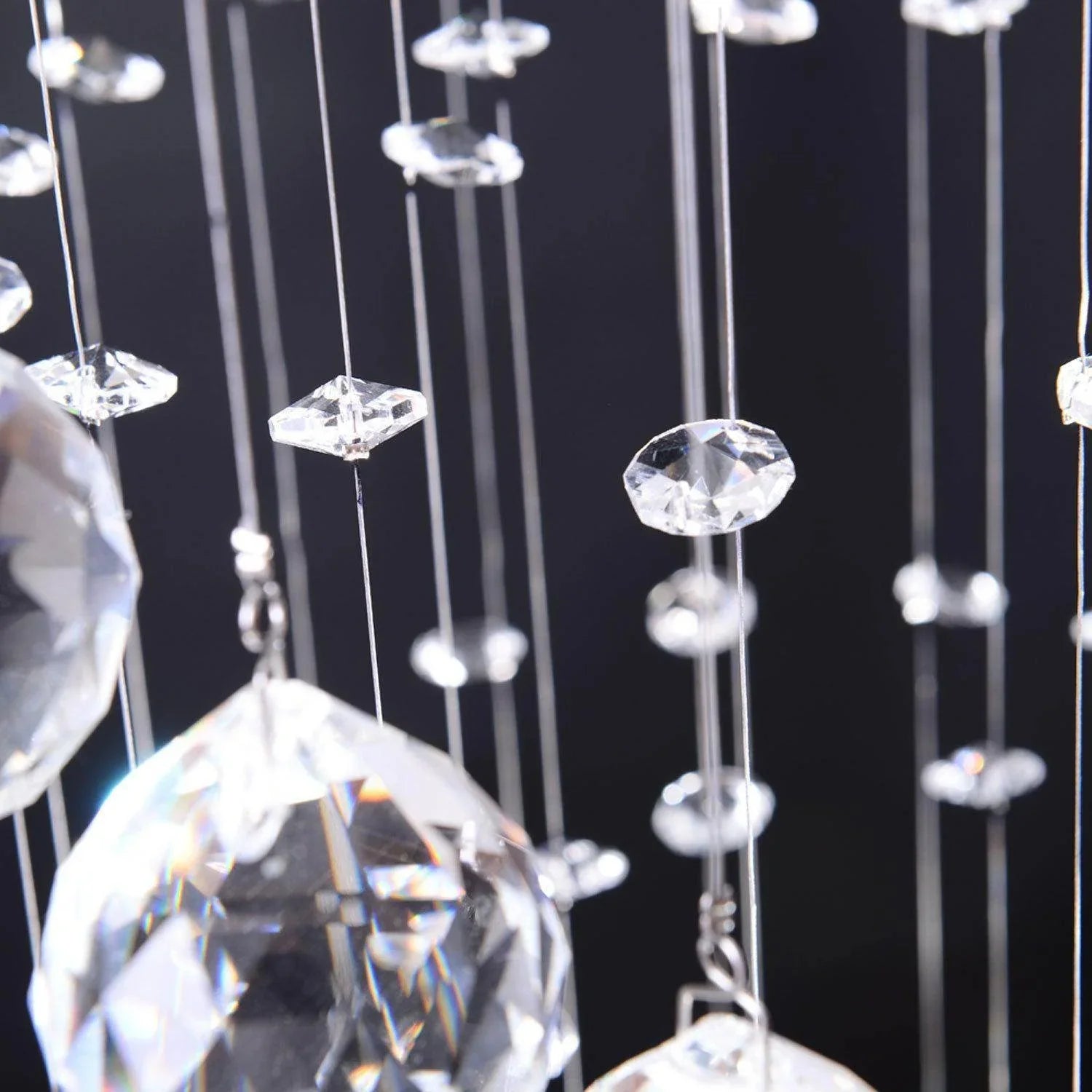 Close-up of HOMCOM spiral crystal chandelier with multiple hanging octagon crystals against dark background