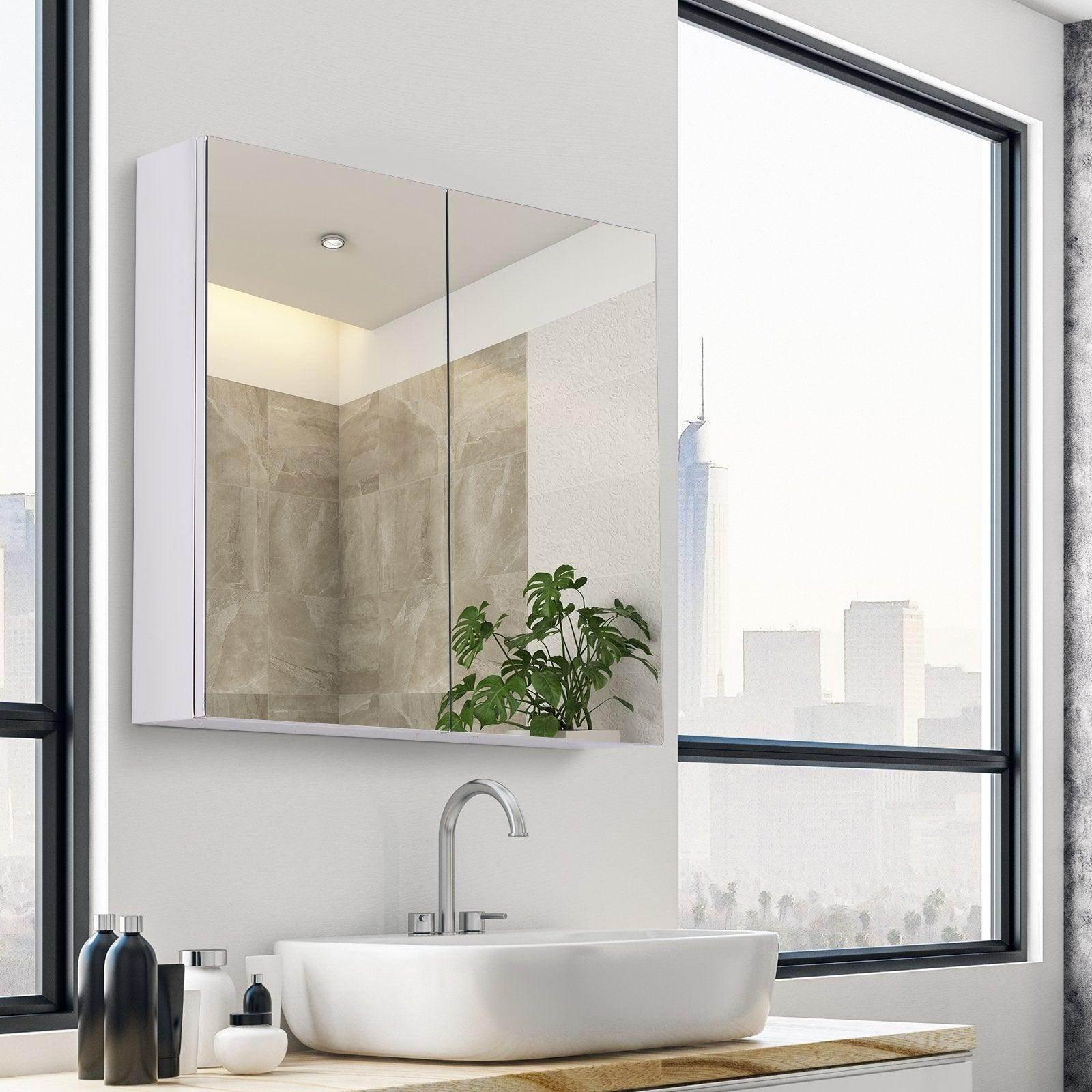 Modern bathroom with stainless steel double door mirror cabinet, white sink, and large window city view
