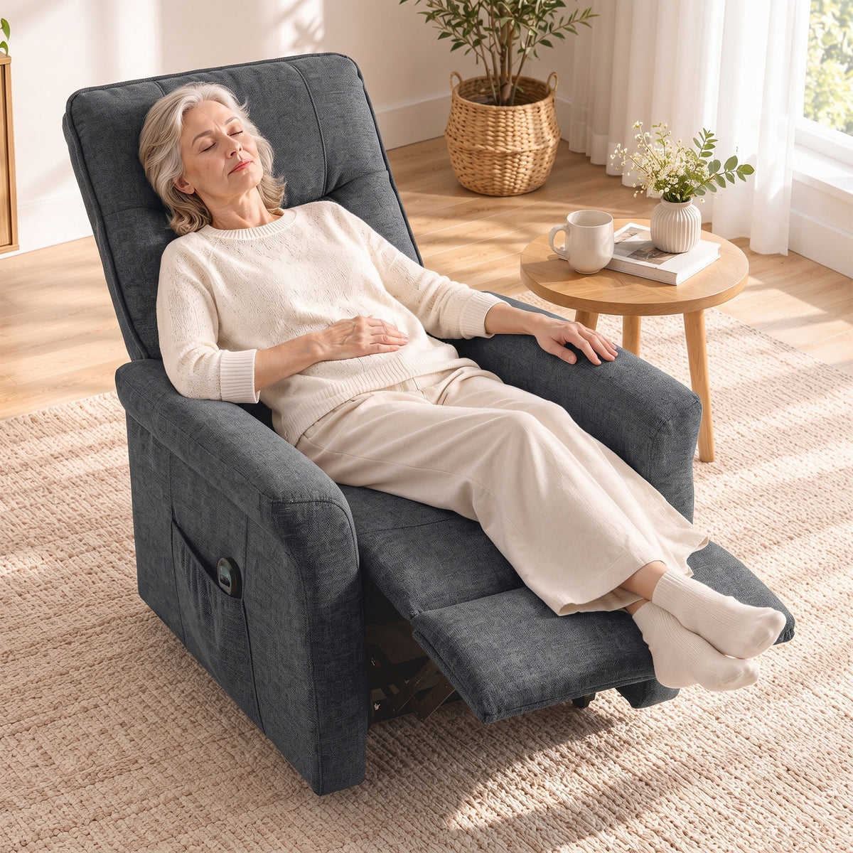 Dark grey chenille power recliner chair showing relaxed back and extended footrest