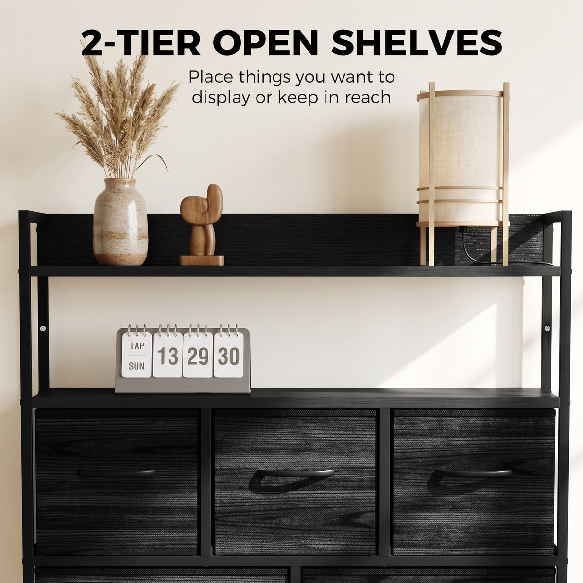 Black fabric dresser with two-tier open shelves and three drawer sections, front view