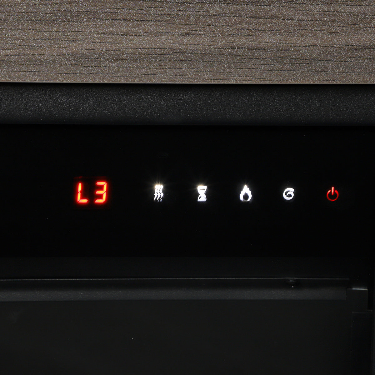 Close-up of the fireplace control panel with illuminated indicator lights