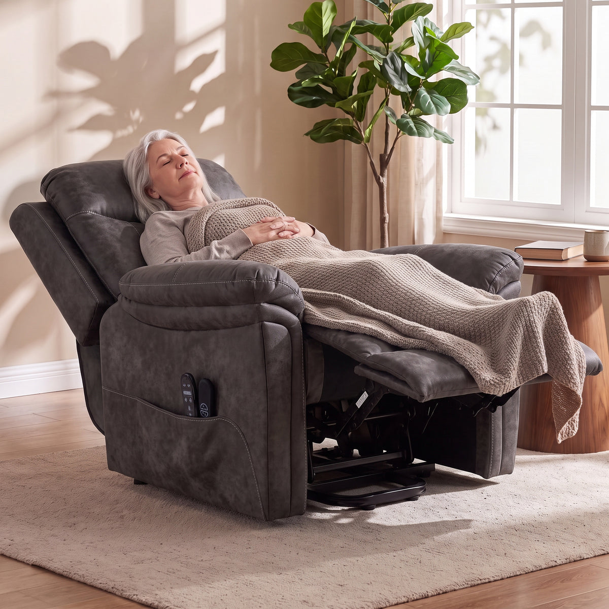 Grey electric lift recliner with extended legrest and plush padded armrest