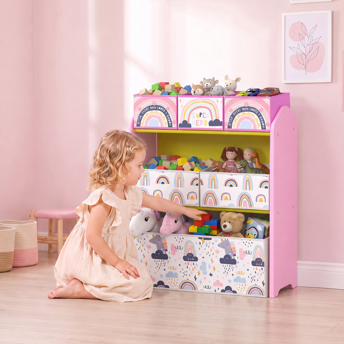 Pink 3-tier toy storage rack with six fabric bins, rainbow and cloud patterns, front view
