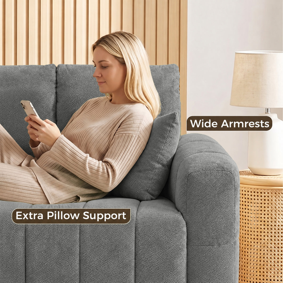 Grey velvet sofa with wide armrests and cushioned side panels.