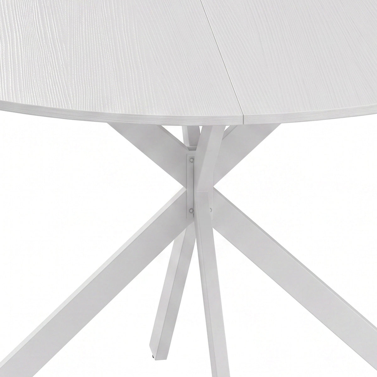 Close-up of white steel X base under a round tabletop