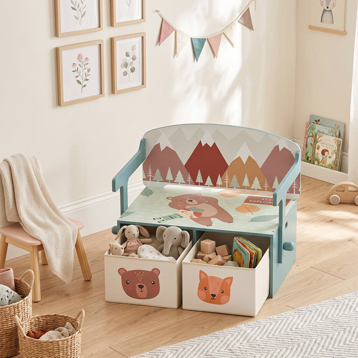Woodland-themed kids bench with open toy boxes and storage drawers, green frame