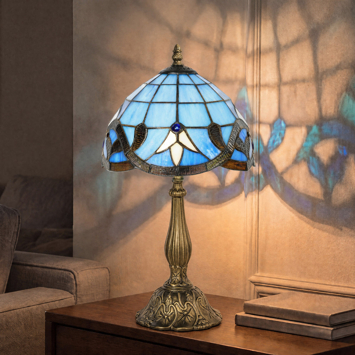 Blue stained glass table lamp with antique bronze base and domed Tiffany-style shade