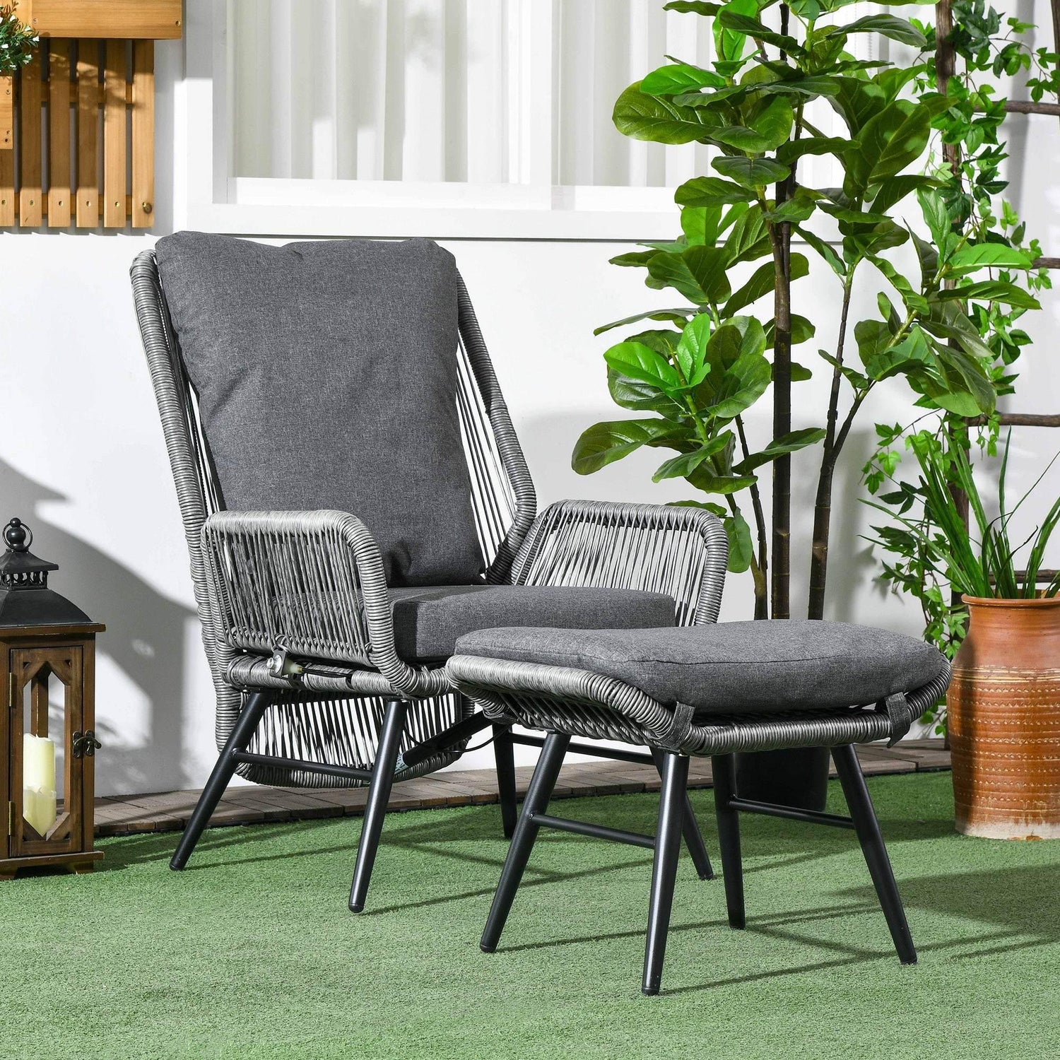 Grey outdoor reclining chair with attached seat and back cushions, PE rattan weave.
