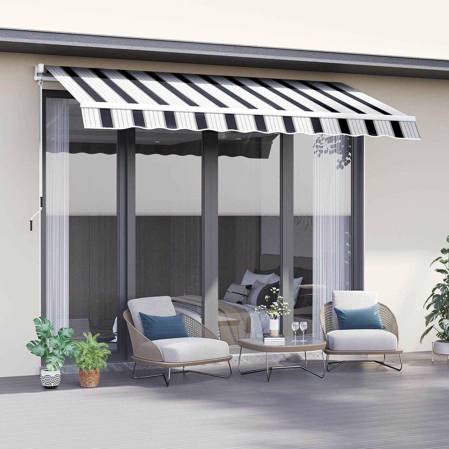 Blue and white striped manual awning with winding handle shading modern patio seating area