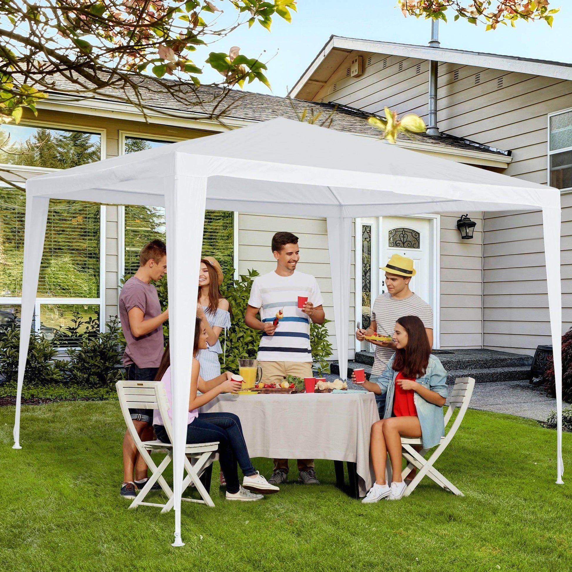 White garden gazebo with six people dining outdoors on green lawn, modern home in background