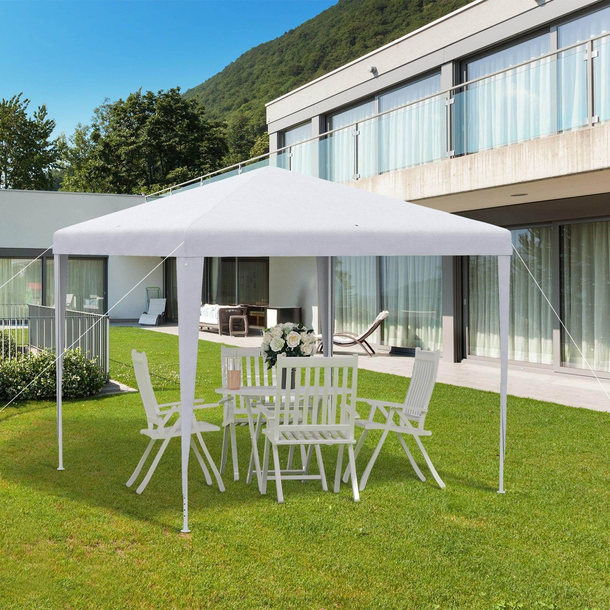 White 2.7m garden gazebo with outdoor dining set on grass lawn outside modern home