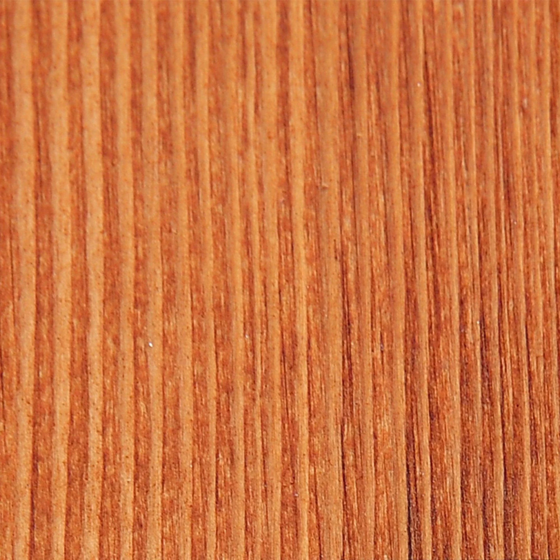 Close-up of natural wood grain texture, showing warm brown tones and vertical lines