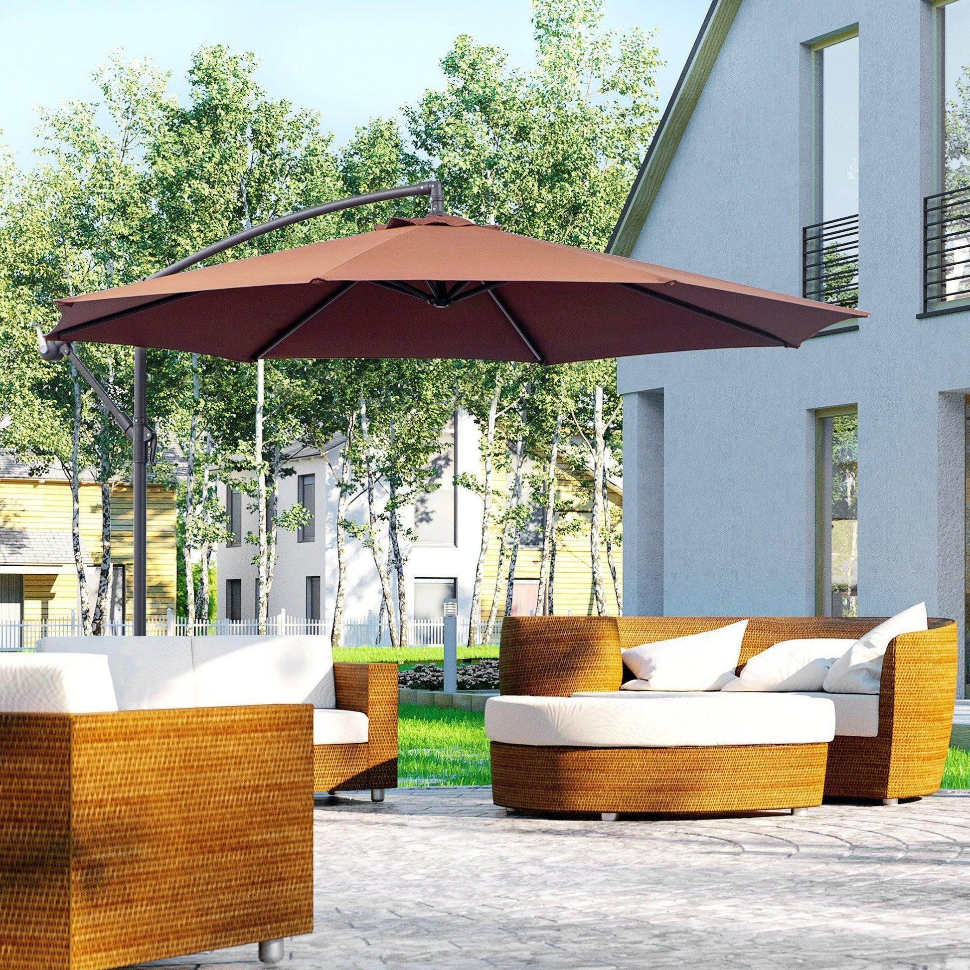 Outdoor patio set with brown woven rattan sofas and white cushions under a 3m hanging coffee-colored umbrella in garden