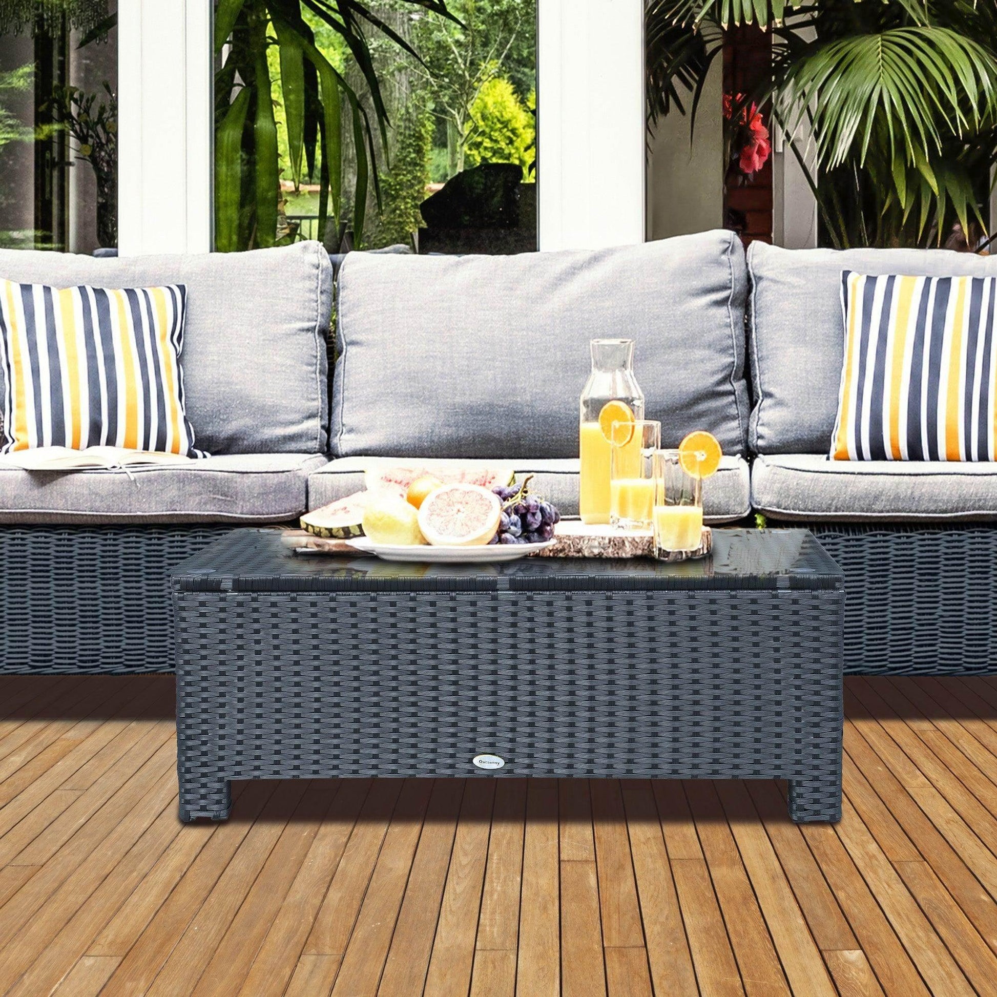 Black rattan coffee table with glass top, outdoor sofa, and drinks on patio at ALL4U Retailer Ltd