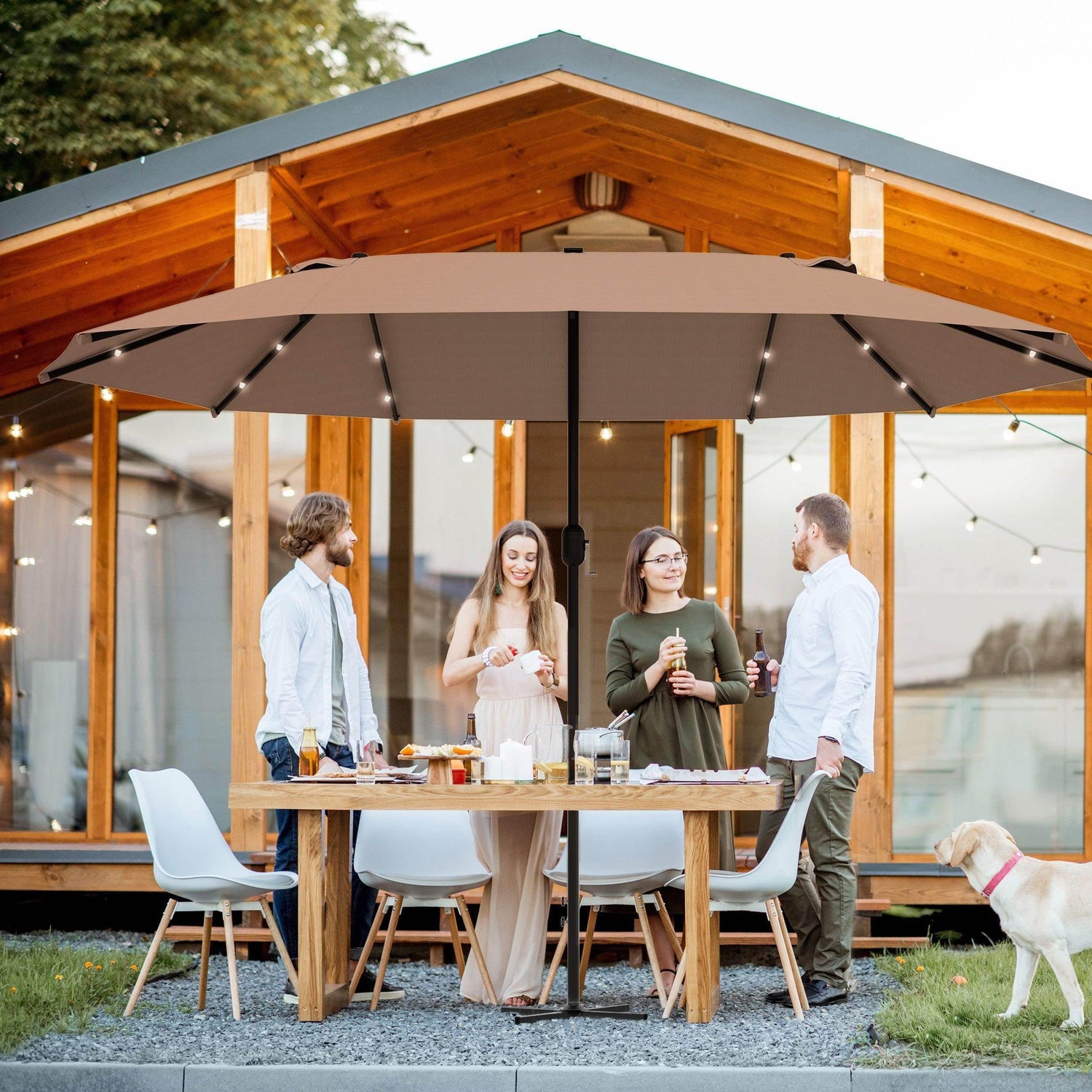 Double-sided sun umbrella with khaki canopy over outdoor dining table