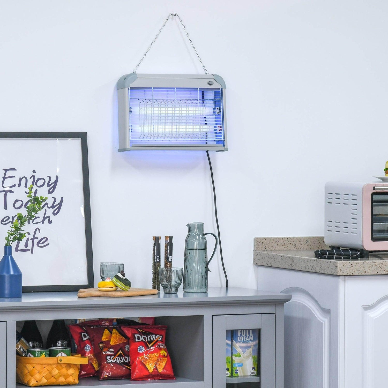 Hanging electric bug zapper with glowing insect grid, white and gray housing