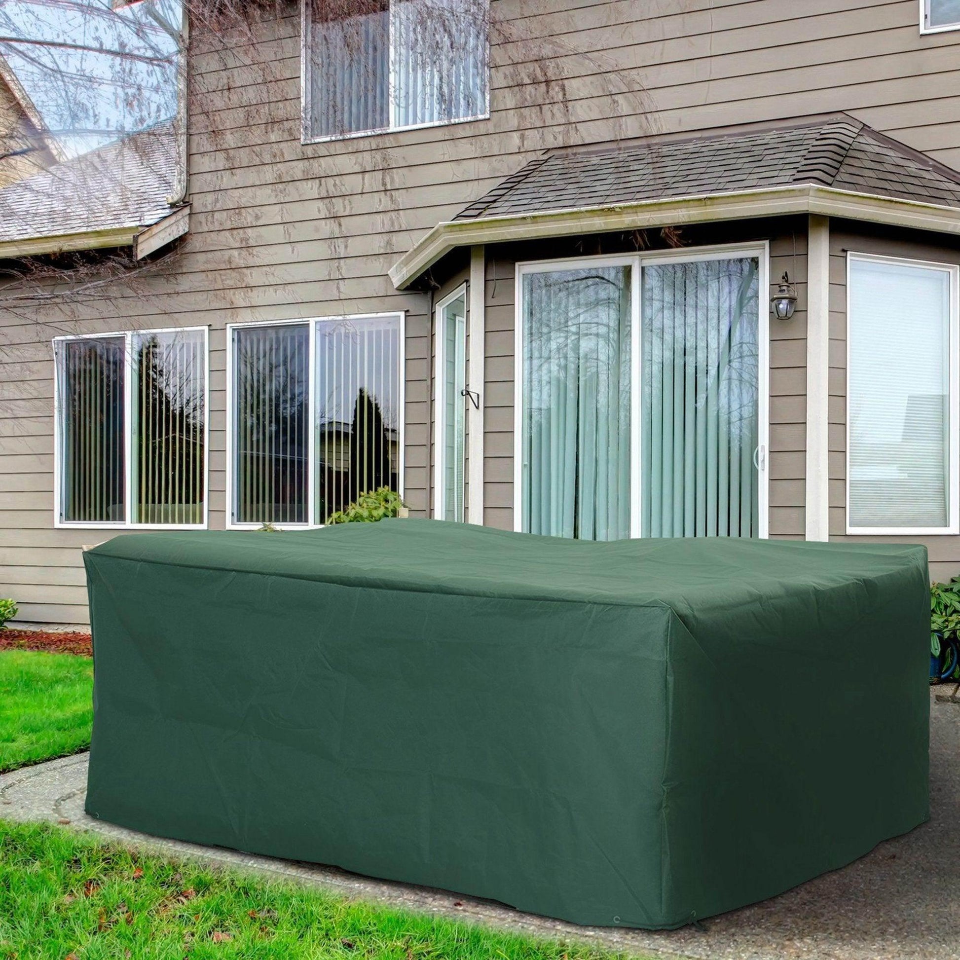 Green outdoor furniture cover protecting patio set in a garden by a house, ALL4U RETAILER LTD