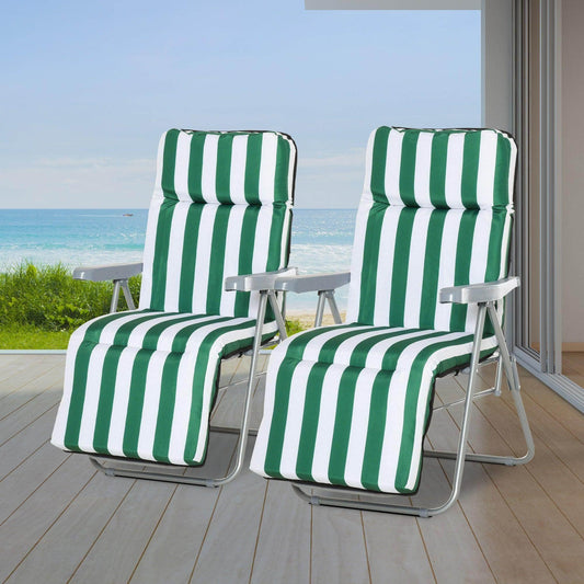 Set of 2 green and white striped outdoor reclining sun loungers on wooden deck overlooking ocean
