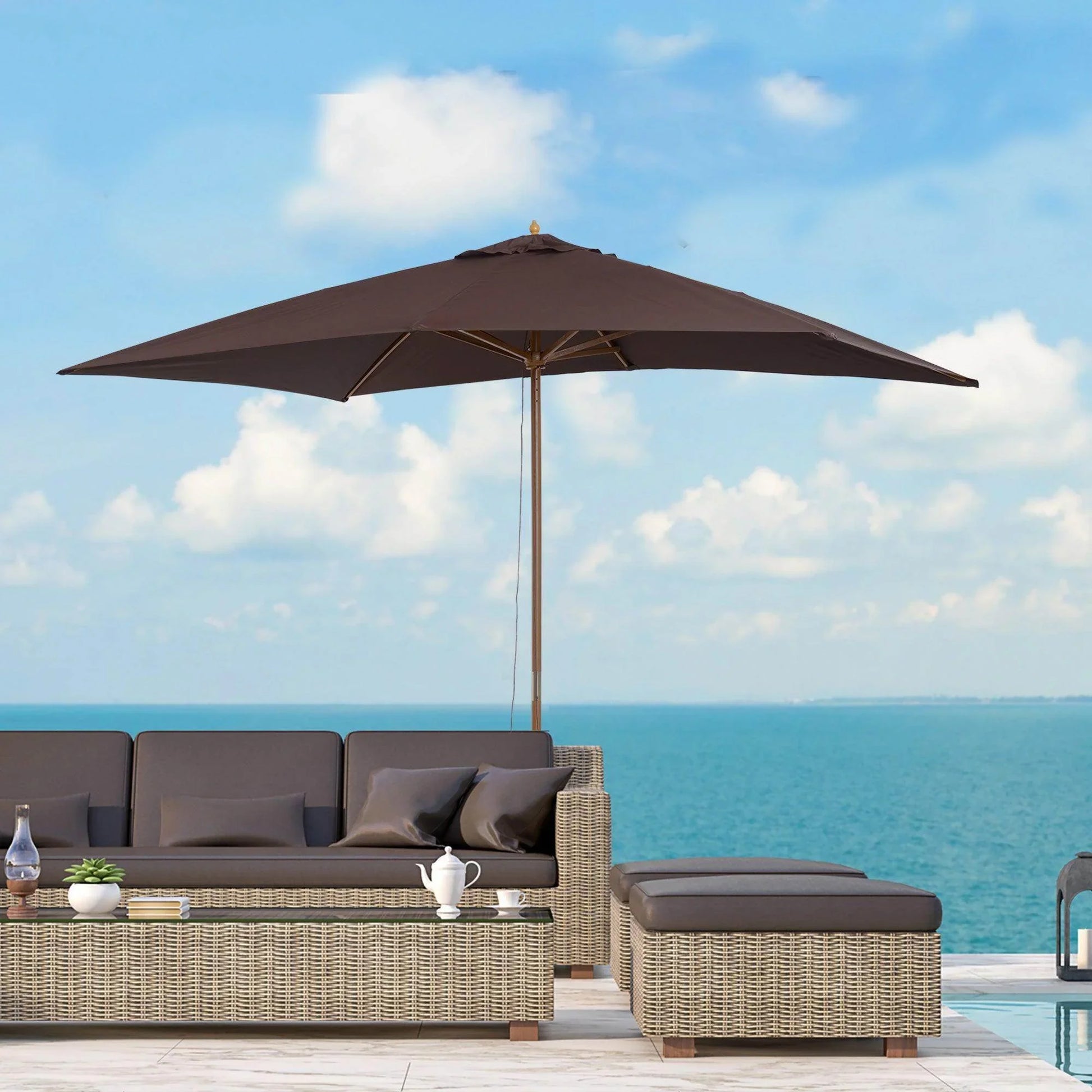 Coffee-colored wooden garden parasol umbrella over rattan outdoor sofa set by the sea