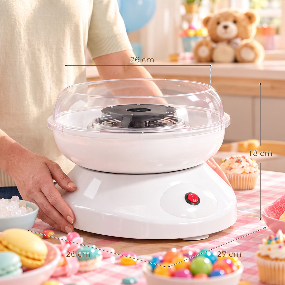 Electric cotton candy maker with clear bowl, black spinning plate, and size markings