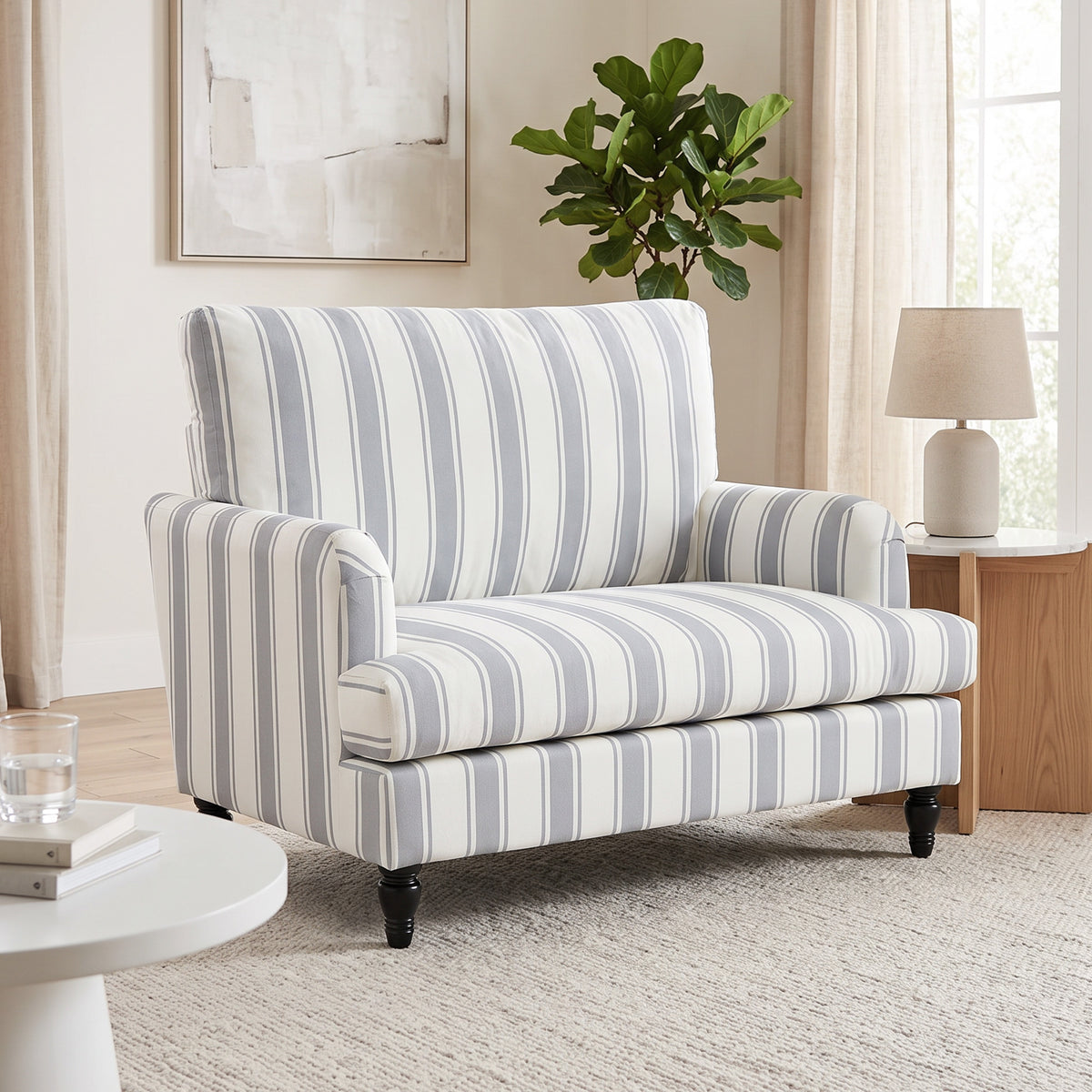 Grey striped velvet armchair with wide seat and dark turned legs