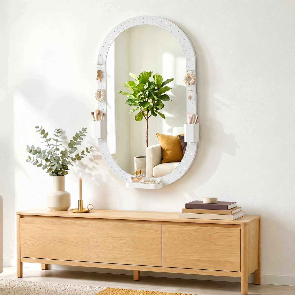 White oval wall mirror with pegboard frame and hanging hook accessories