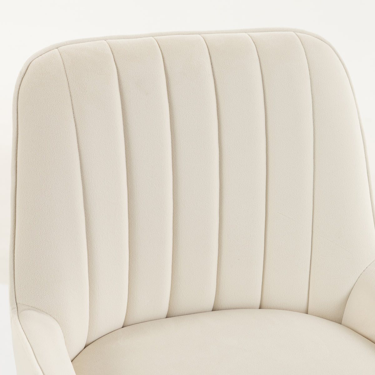 Close-up of cream white upholstered velvet backrest with vertical pleats on bar stool