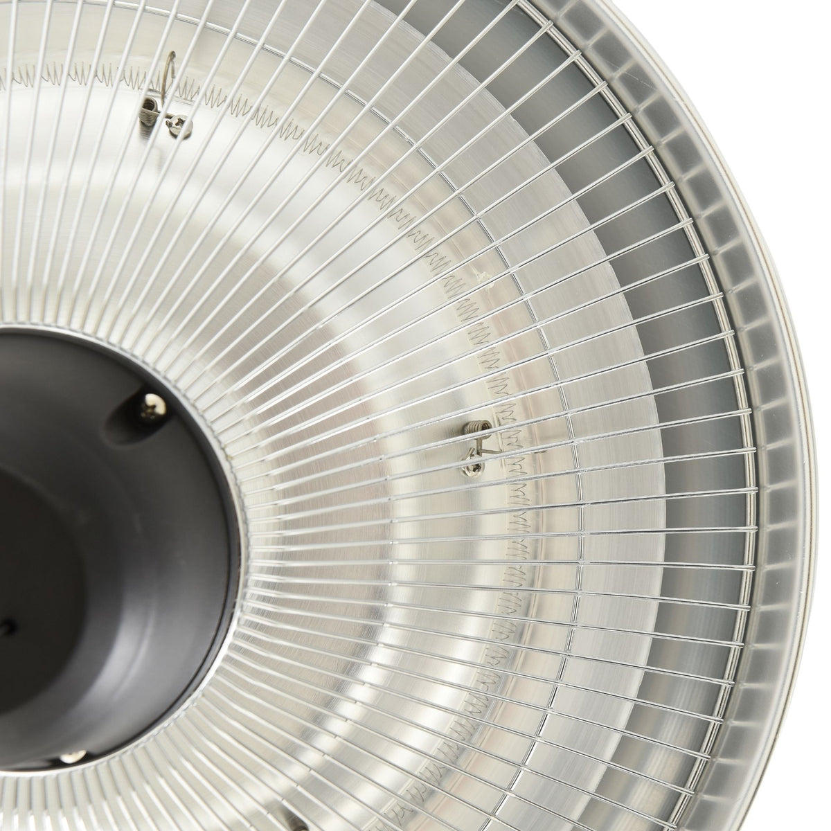 Close-up of halogen heater protective metal mesh and reflective surface