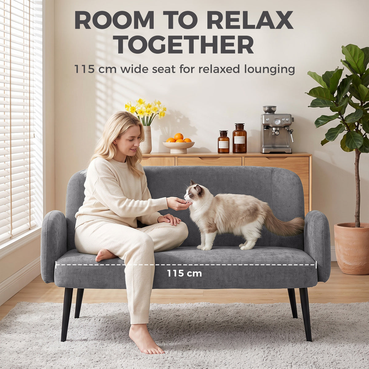 Light grey velvet sofa with wide 2-person seat, rounded arms, and dark legs