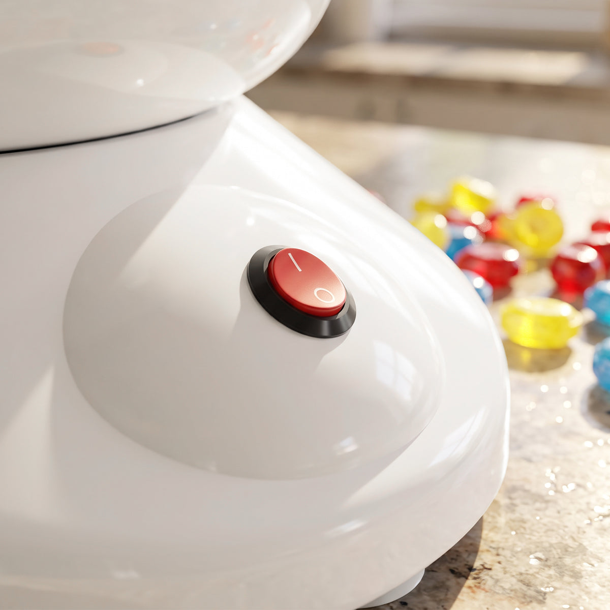 Electric cotton candy maker with red power button on white base