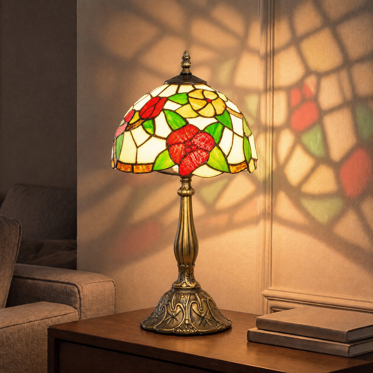 Red and green stained glass table lamp with floral shade and brass pedestal base