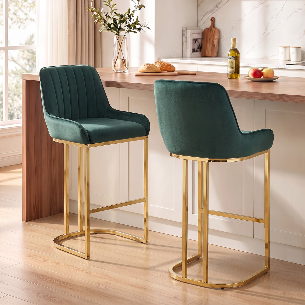 Set of two dark green velvet bar stools with backrests and wide cushioned seats