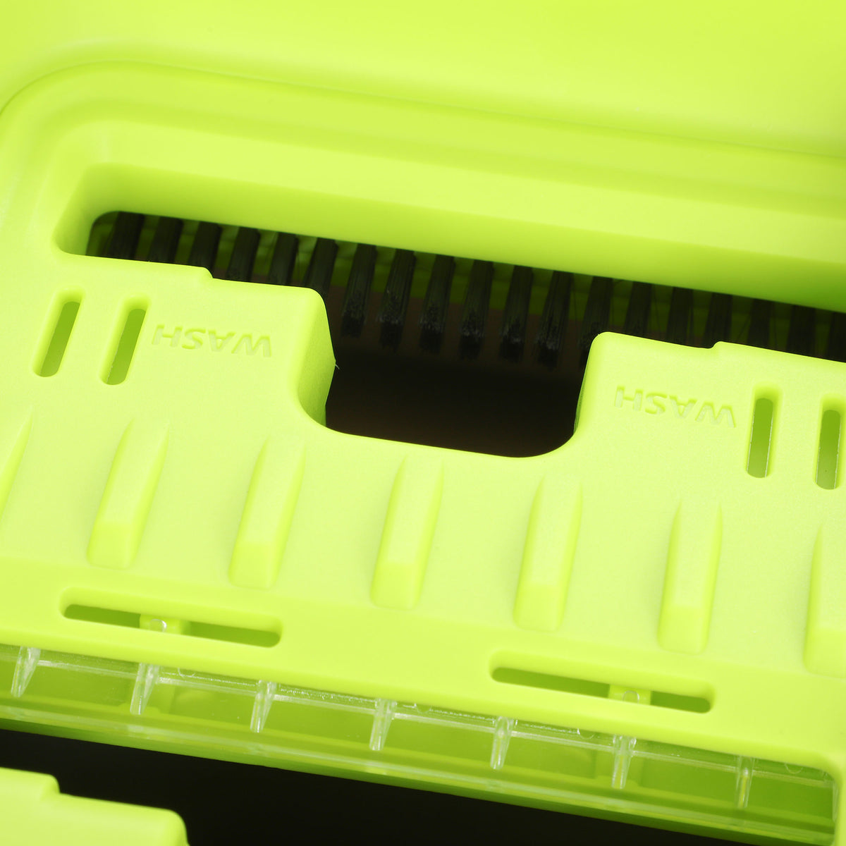 Close-up of green flat mop head with microfiber pad channels for water distribution