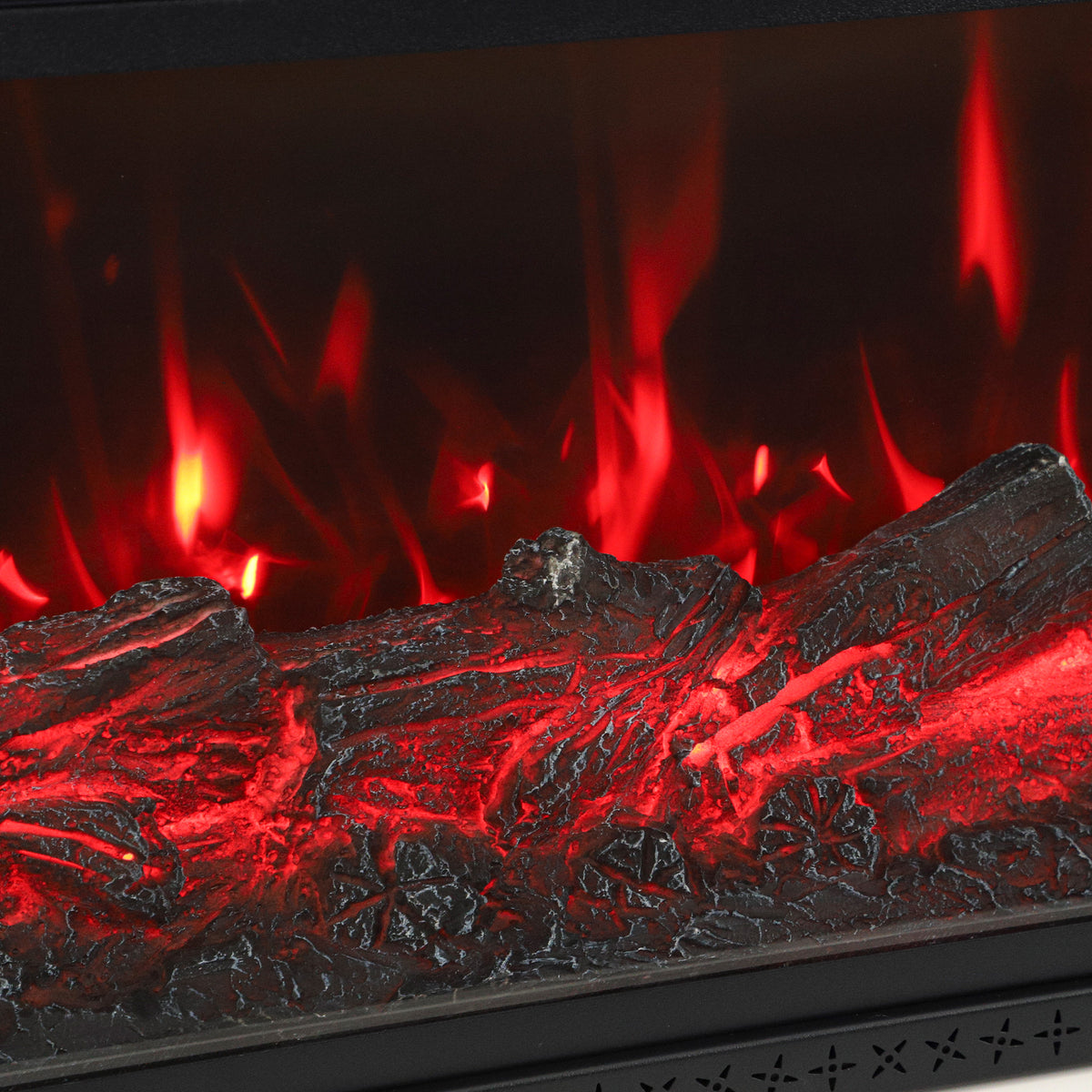 Close-up of electric fireplace log and ember flame bed glowing red