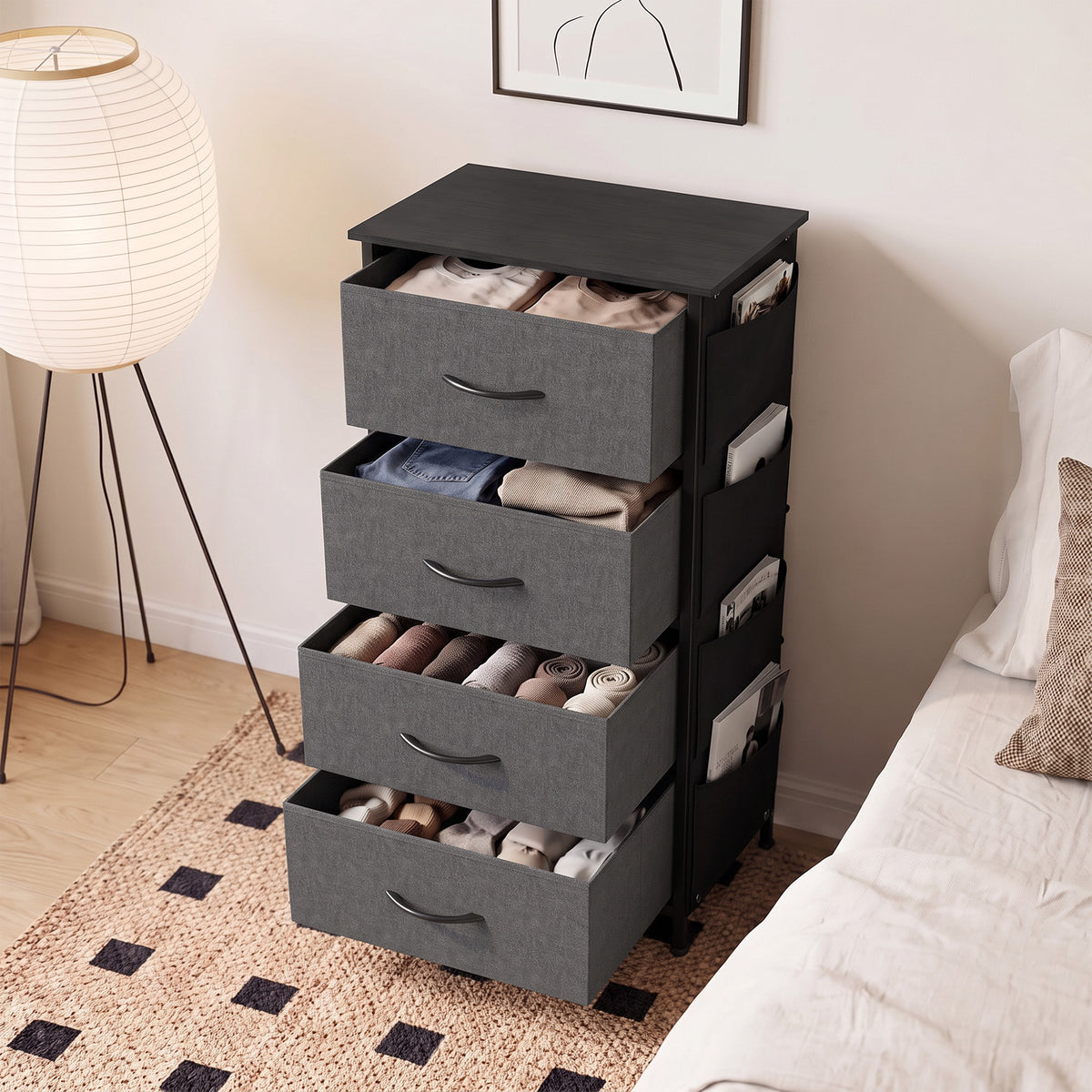 Grey fabric dresser with four open drawers and curved drawer pulls, shown from a side angle