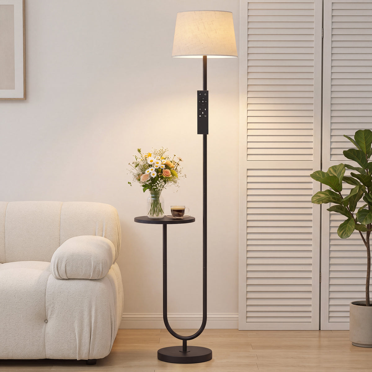 Floor lamp with linen fabric shade and built-in round side shelf near sofa
