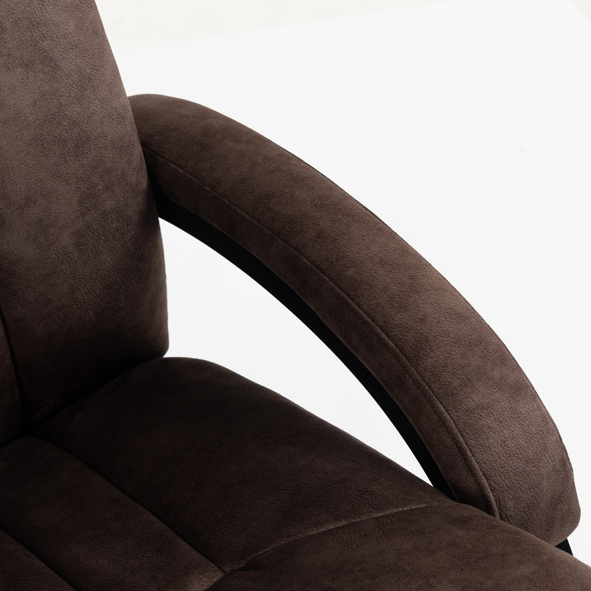 Dark brown velvet recliner arm and padded seat with curved armrest detail