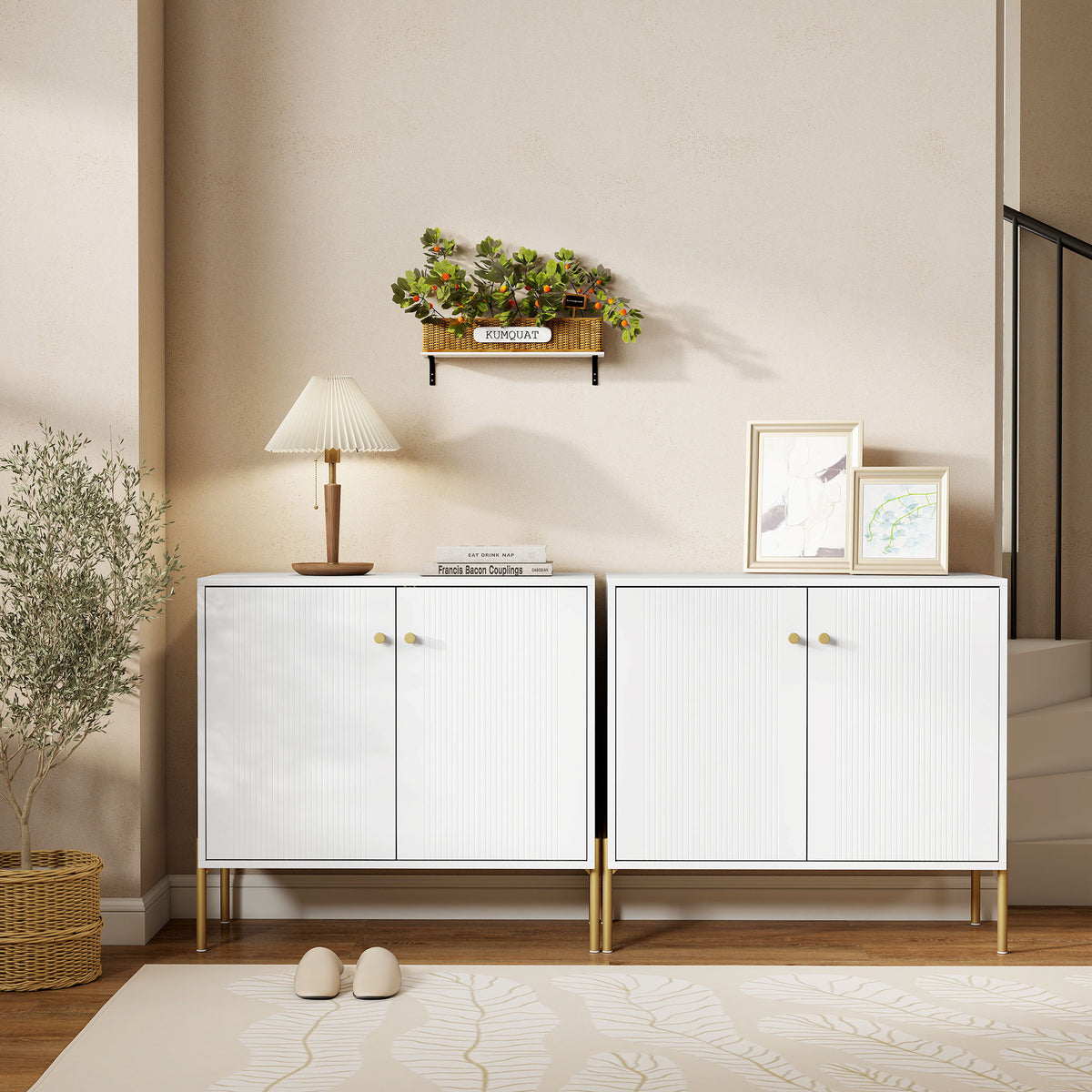 White sideboard with fluted doors on gold legs, shown in a living-room styling